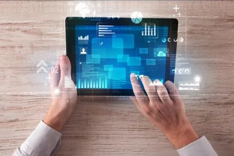 Hand holding tablet Stock Photos