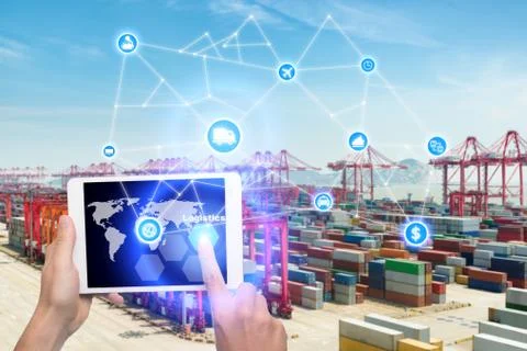 Hand holding tablet is pressing button Logistics connection technology interf Stock Photos