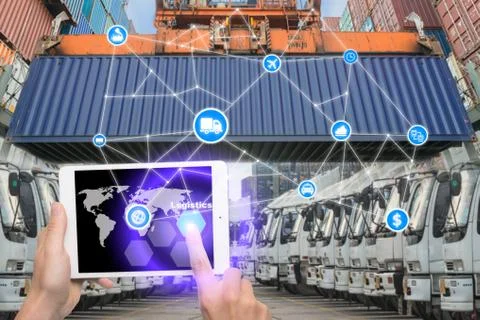 Hand holding tablet is pressing button Logistics connection technology interf Stock Photos