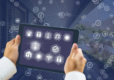 Hand holding tablet with smart home interface and connectors Stock Photos