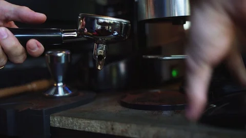 Hand holding tamper with ground coffee Video stock 99323965