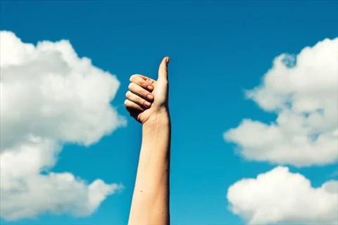 A hand holding thumb up Stock Photos