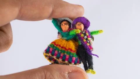 Hand holding tiny peruvian dolls Stock Photos