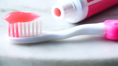 Hand holding tooth brush with paste Stock Footage 218975008