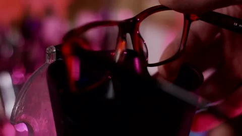 Hand Holding Tortoiseshell Eyeglasses Frame, Optical Store Display, Close Up Stock Footage 341522273