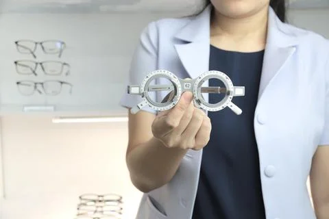 Hand holding trial frame 스톡 사진