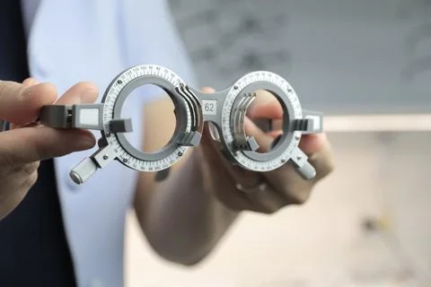 Hand holding trial frame 스톡 사진