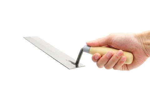Hand holding a trowel Stock Photos