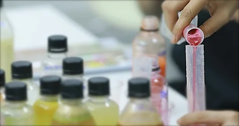 Hand holding tubes of beetroot juice. Stock Footage 98965486