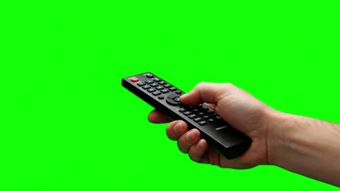 Hand Holding TV Remote Control on Green Screen Background Stock Footage 313114664