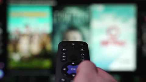 Hand Holding the TV Remote Control Surfing Smart Television Stock Footage 337388873
