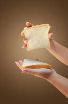 Hand holding two slices of bread Stock Photos