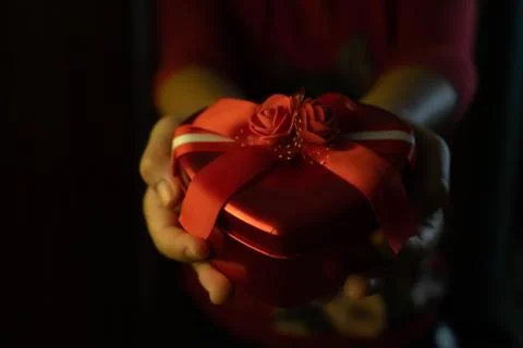 Hand holding valentine gift Stock Photos