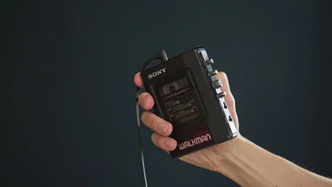 A hand holding a vintage Walkman and showing it to the camera. Stock Footage 306540161