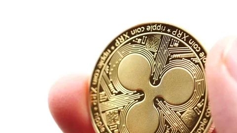 Hand holding a virtual bit-coin coin between his fingers. Stock Footage 124809027