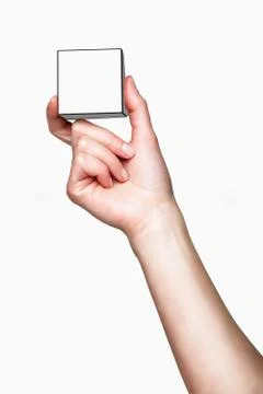 Hand holding white cube Foto stock