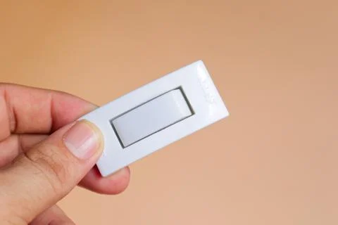 Hand Holding White Electrical Switch Stock Photos