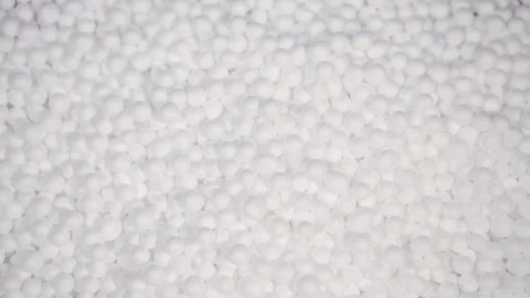 Hand holding white polystyrene foam beads ball Stock Footage 129276489
