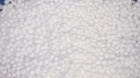 Hand holding white polystyrene foam beads ball Stock Footage 129279368