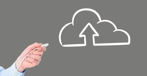 Hand holding wire connection with cloud upload Stock Photos