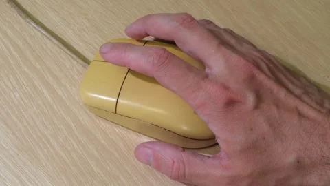 Hand Holding Wooden Computer Mouse Stock Footage 310056976