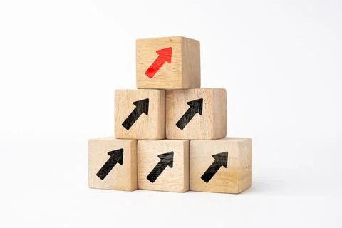 Hand holding wooden cube blocks print up arrow on white background with spa.. Stock Photos