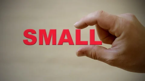 Hand holding the word SMALL Stock Footage 60113524