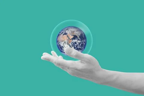 Hand holding the world. element of this image are furnished by NASA Stock Photos