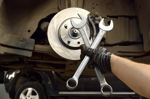 Hand holding wrenches in shallow depth of field 스톡 사진