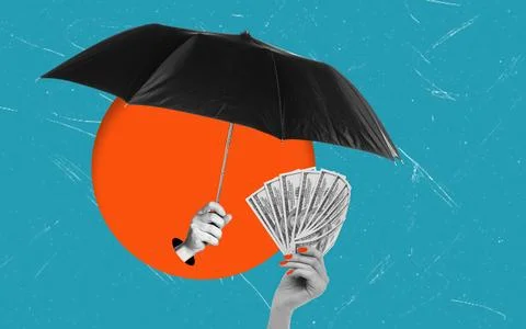 A hand holds bills while another hand raises an umbrella. The background feat Stock Photos