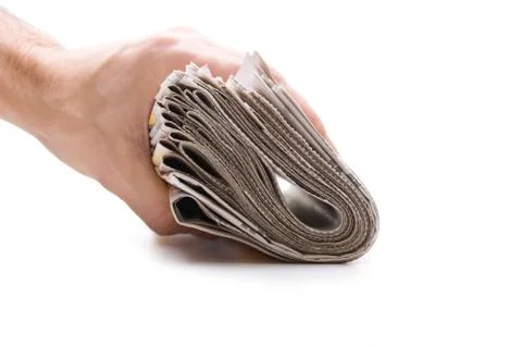 Hand holds a bundle of newspapers Foto stock