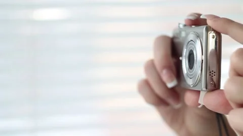 Hand holds camera Stock Footage 1087445