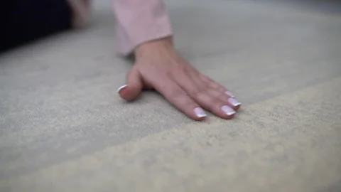 Hand holds on the carpet Stock Footage 101324416