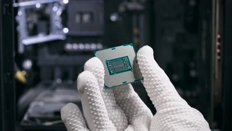 The hand holds the central processing unit. The processor is ready to be Stock Footage 147655628