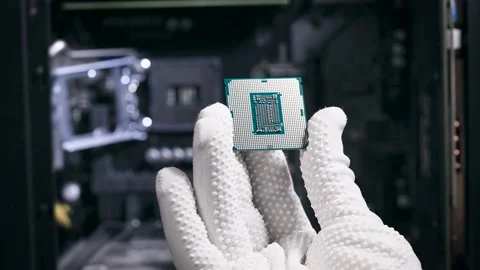 The hand holds the central processing unit. The processor is ready to be Stock Footage 148613507