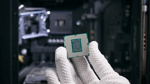 The hand holds the central processing unit. The processor is ready to be Stock Footage 148816926