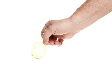 Hand holds chips on a white background, close up Stock Photos
