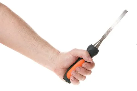 Hand holds a chisel on a white background, template for designers. Stock Photos