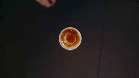 Hand holds cup of coffee against dark background Stock Footage 332452165