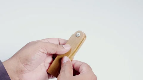 Hand Holds A Folding Comb Stock Footage 248708720