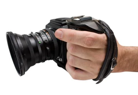 Hand holds the handle of the camera Stock-Fotos