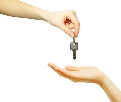 Hand holds a key Stock Photos