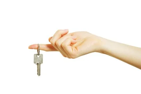Hand holds a key Stock Photos