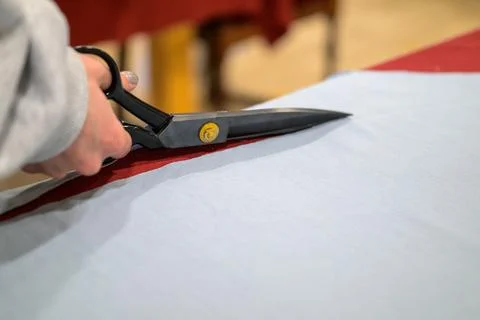 Hand holds large scissors Stock Photos