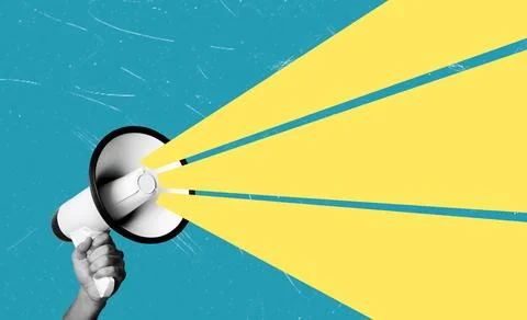 A hand holds a megaphone that projects bright yellow light beams. The backgro Stock Photos