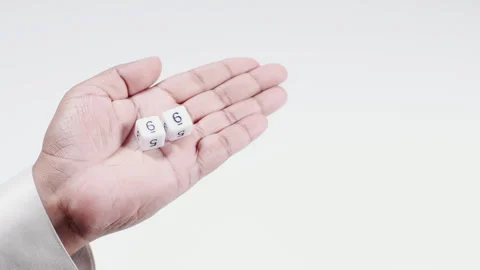 Hand Holds Numbered Dice Six And Six Stock Footage 248741589