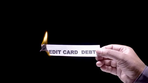 Hand Holds Paper Burning Card debt Video stock 248536741