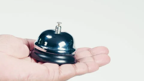 Hand Holds a Reception Bell Stock Footage 248713176