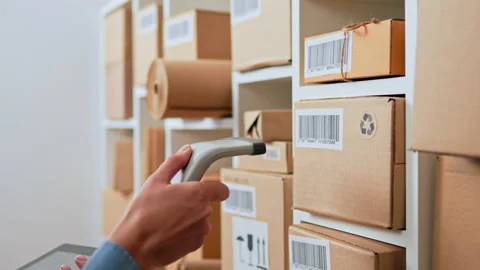 hand holds the scanner scans the barcode... | Stock Video | Pond5