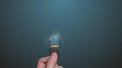 Hand holds SD memory card using futuristic animation. Stock Footage 104055909